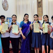 Winners of the Indian Talent Olympiad displaying their medals and certificates