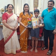 class 3 winner of Spell Bee International with esteemed Dignitaries